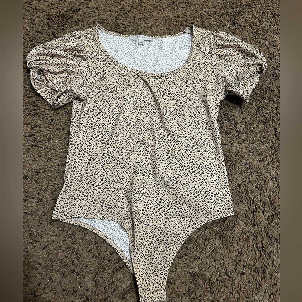 Never worn cheetah body suit size M
